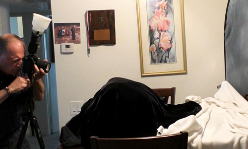 GRANDPA PHOTOGRAPHER SETTING UP BACKDROPS IN HOME